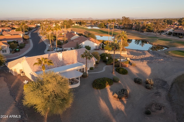 aerial view at dusk with a water view