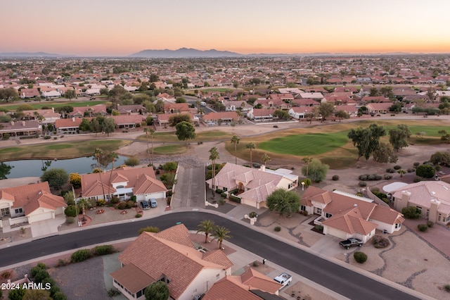 aerial view at dusk with a water view