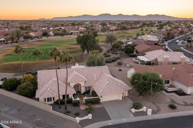 aerial view at dusk with a mountain view