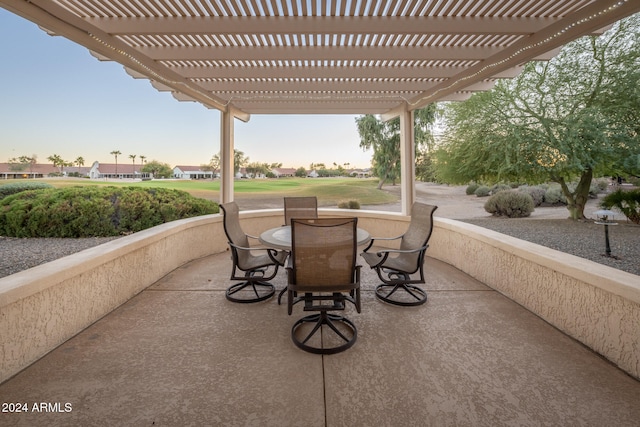 patio terrace at dusk with a pergola