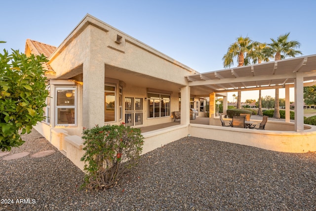 rear view of house featuring a patio