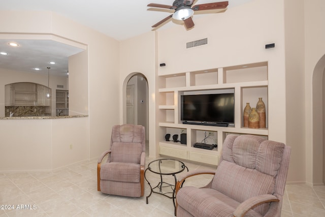 interior space featuring ceiling fan and built in features