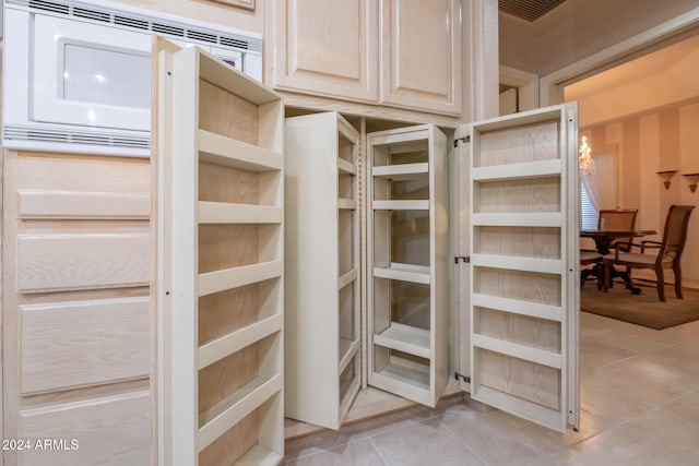 spacious closet with light tile patterned flooring