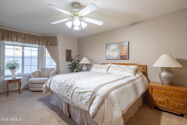 bedroom featuring ceiling fan and light colored carpet