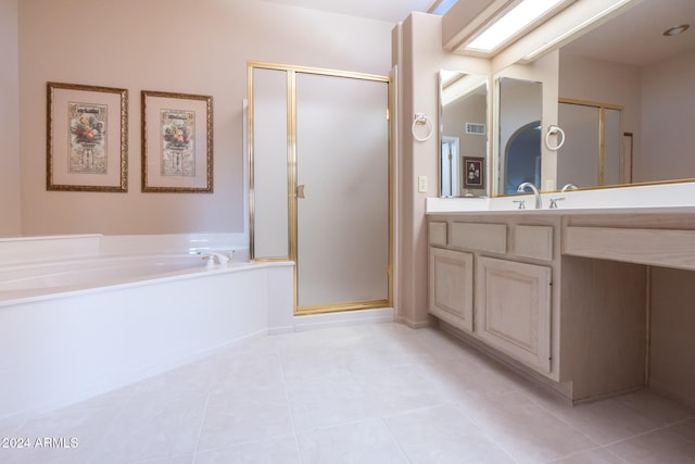 bathroom featuring tile patterned floors, vanity, and independent shower and bath