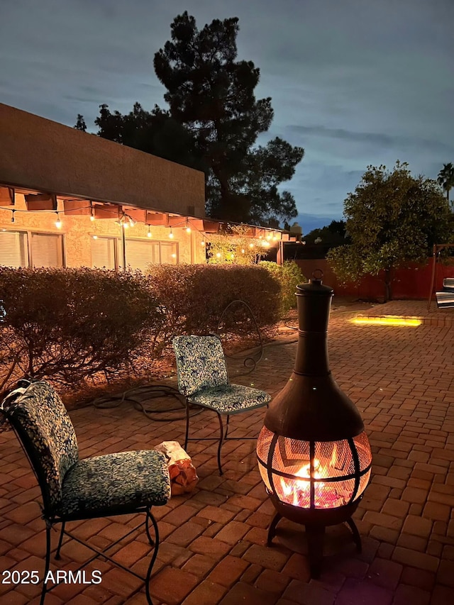 view of patio featuring a fire pit