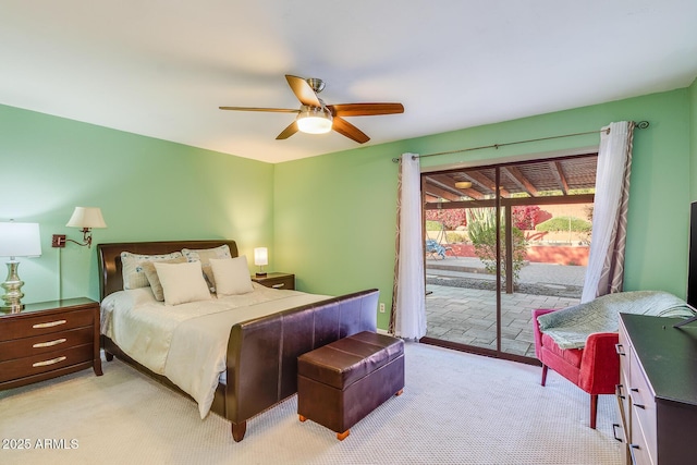 bedroom with ceiling fan, light carpet, and access to outside