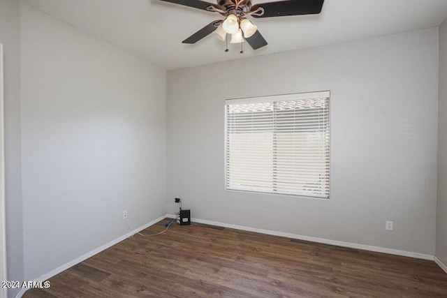 unfurnished room featuring a ceiling fan, baseboards, and wood finished floors