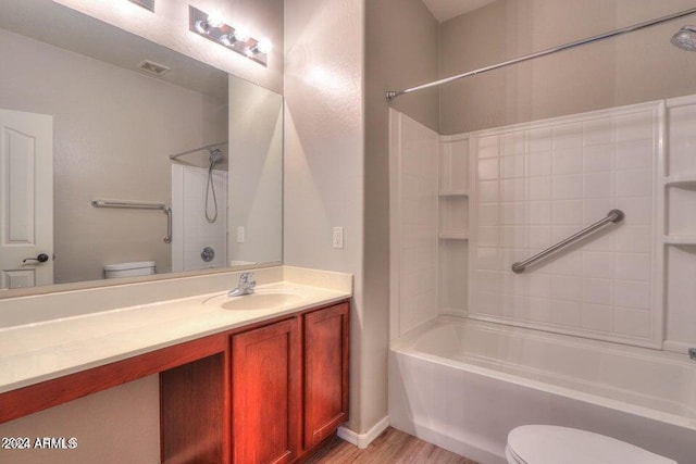 bathroom featuring visible vents, vanity, shower / tub combination, and toilet