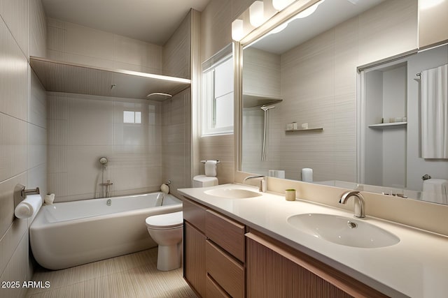 bathroom with washtub / shower combination, a sink, toilet, and double vanity