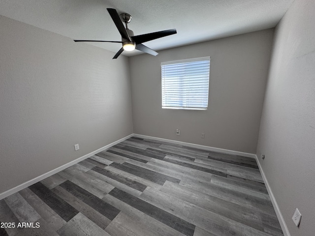 unfurnished room featuring ceiling fan and wood-type flooring