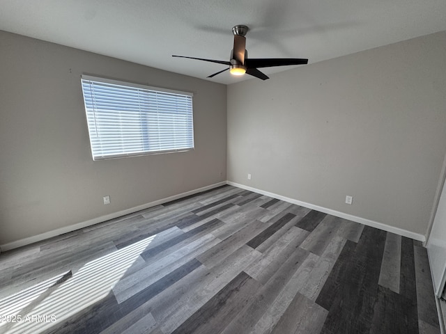 spare room featuring ceiling fan and wood-type flooring