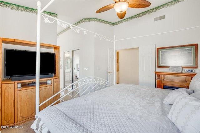 bedroom featuring ceiling fan and hardwood / wood-style flooring