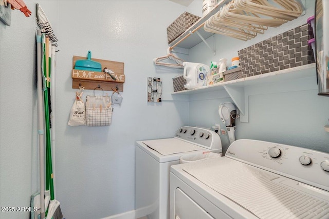 laundry area with washing machine and dryer