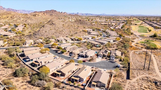 birds eye view of property featuring a mountain view