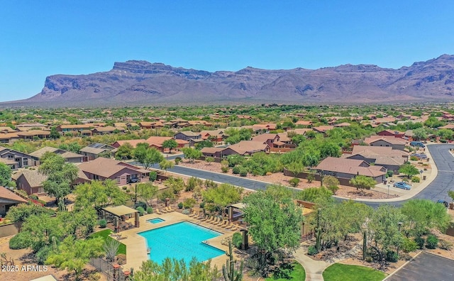 birds eye view of property with a mountain view