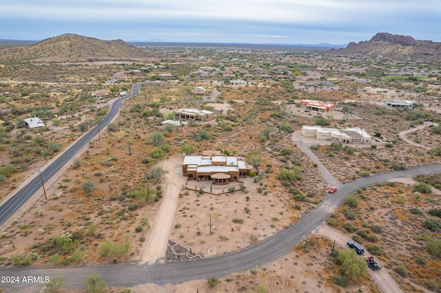 birds eye view of property featuring a mountain view