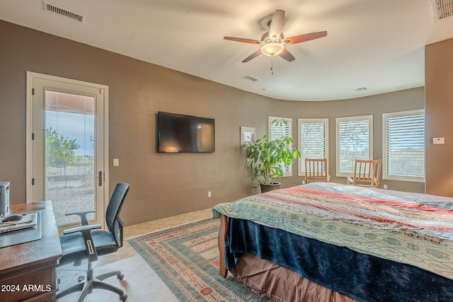 bedroom with access to outside, visible vents, and carpet flooring