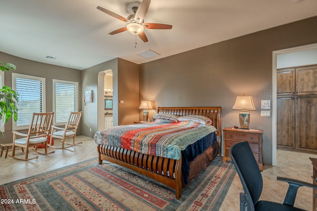 bedroom with arched walkways and visible vents