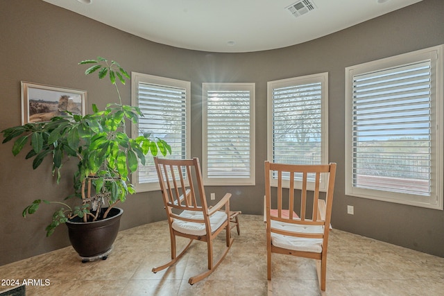 dining space with visible vents and light tile patterned floors