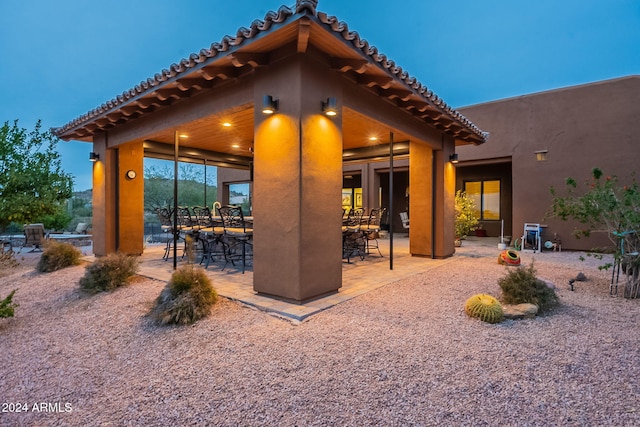 view of patio terrace at dusk