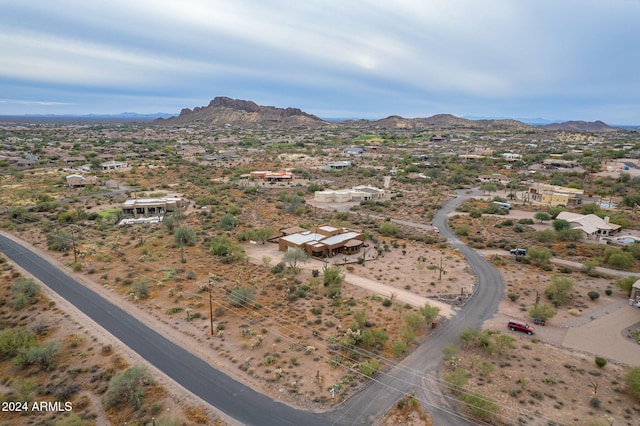 birds eye view of property with a mountain view