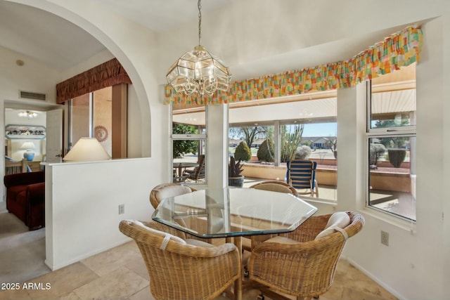 dining space featuring a chandelier