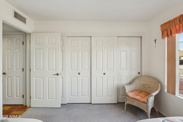 carpeted bedroom with a closet