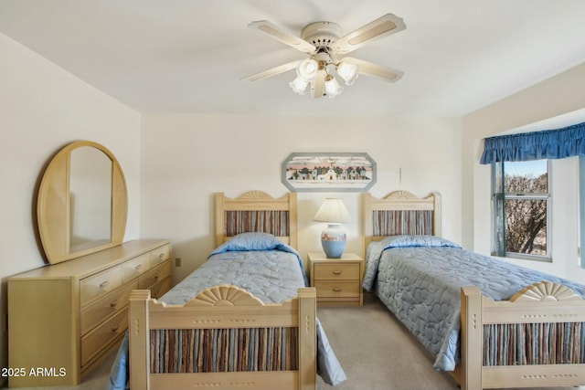 bedroom featuring light colored carpet and ceiling fan