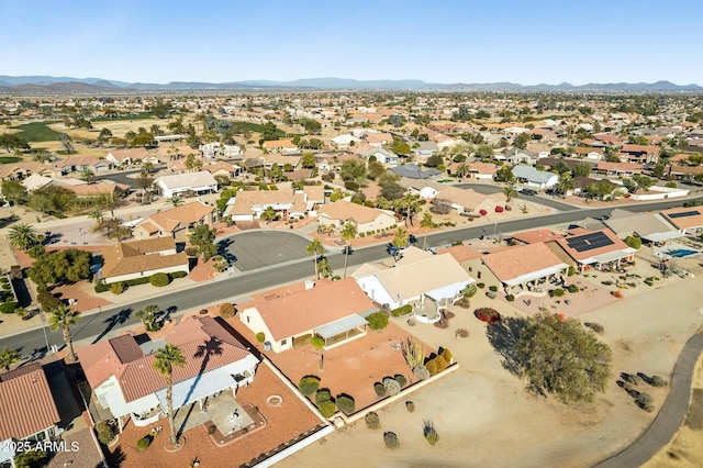 birds eye view of property with a mountain view