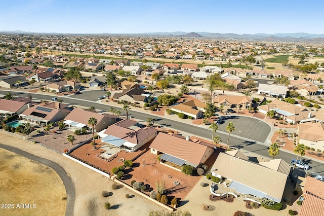 birds eye view of property featuring a mountain view