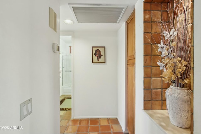 corridor featuring light tile patterned floors