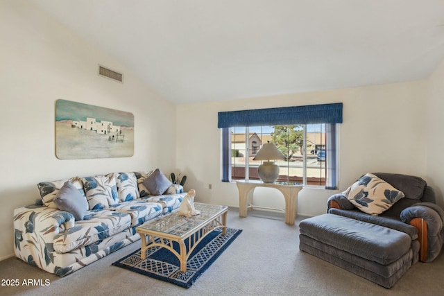 carpeted living room with lofted ceiling