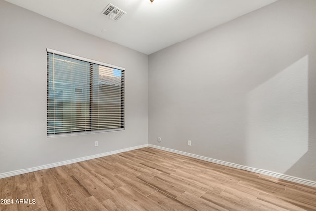 spare room featuring light hardwood / wood-style flooring