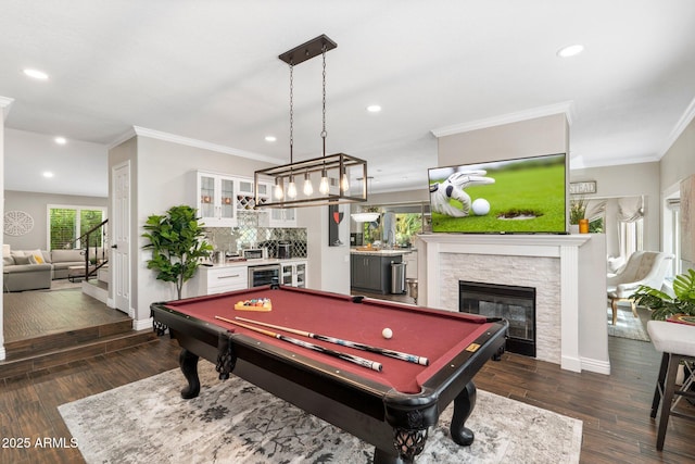 rec room with plenty of natural light, crown molding, and dark hardwood / wood-style floors