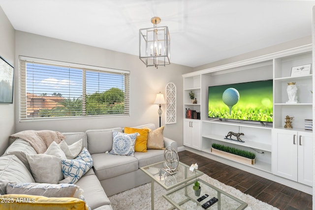 living room featuring dark hardwood / wood-style flooring and a chandelier