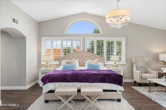 bedroom with dark wood-type flooring, multiple windows, an inviting chandelier, and vaulted ceiling