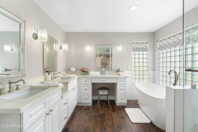 bathroom with vanity and a bathing tub