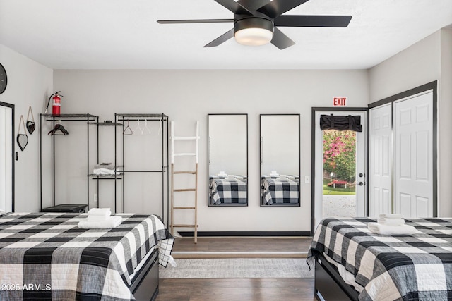 bedroom with ceiling fan, a closet, dark hardwood / wood-style flooring, and access to outside