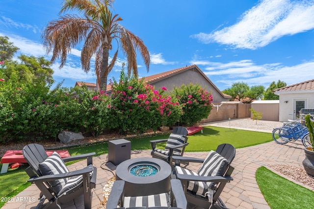 view of patio / terrace with a fire pit