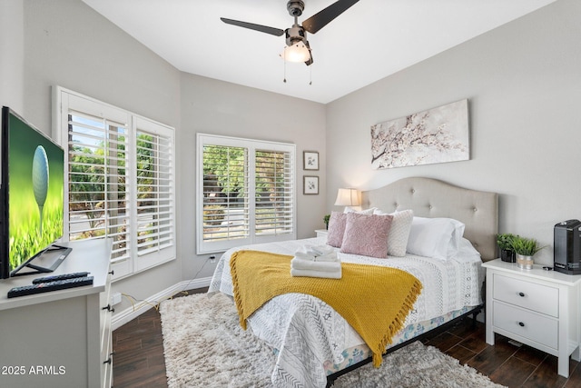 bedroom featuring ceiling fan and dark hardwood / wood-style flooring