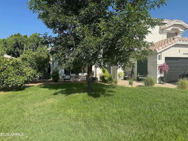 view of yard featuring a garage