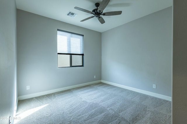 unfurnished room featuring ceiling fan and carpet floors