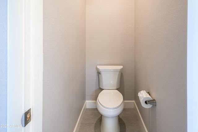 bathroom featuring tile patterned floors and toilet