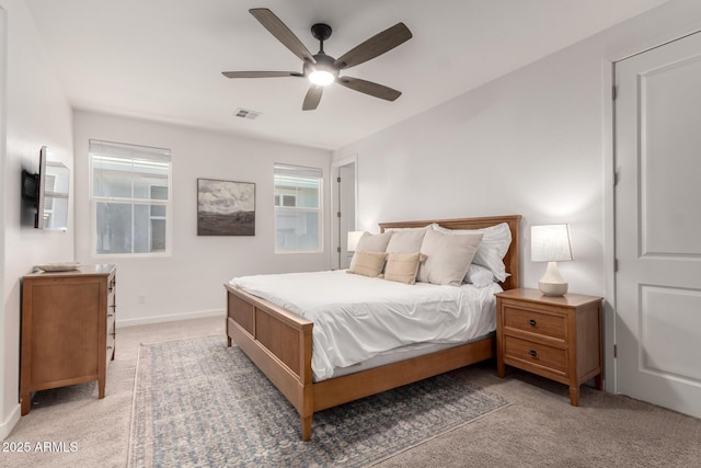 bedroom featuring light carpet and ceiling fan