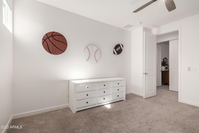 unfurnished bedroom featuring light colored carpet and ceiling fan