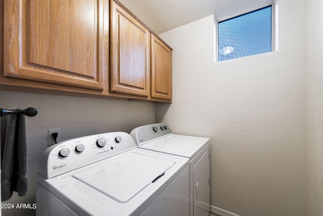 washroom with cabinets and independent washer and dryer