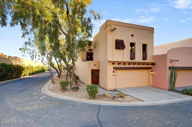 adobe home featuring a garage