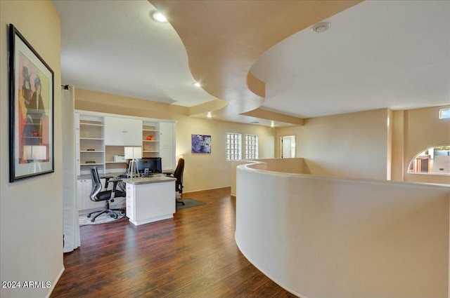 office space with dark wood-type flooring