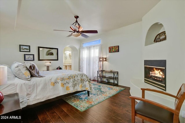 bedroom featuring ceiling fan and dark hardwood / wood-style floors